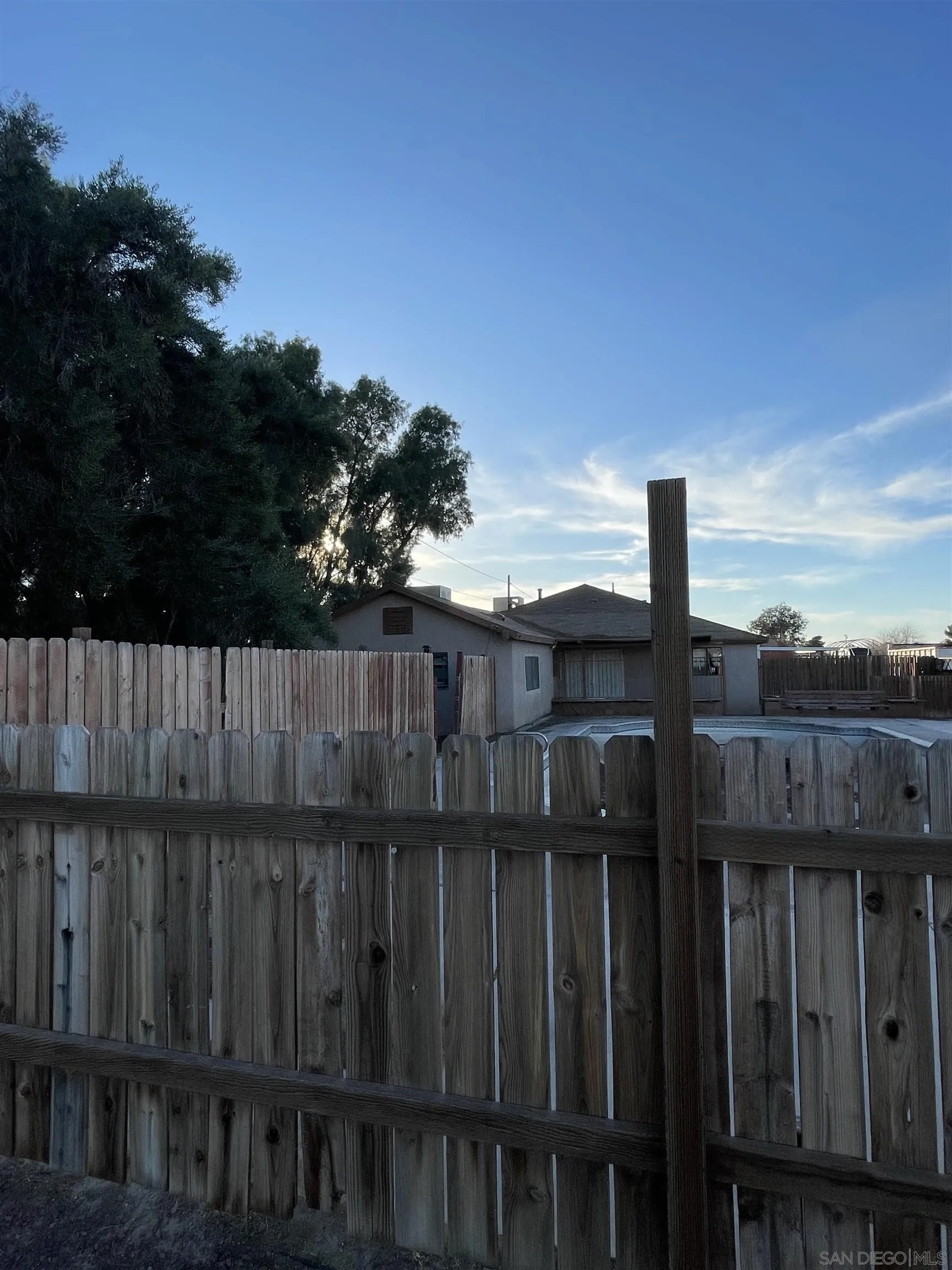 a view of a wooden fence