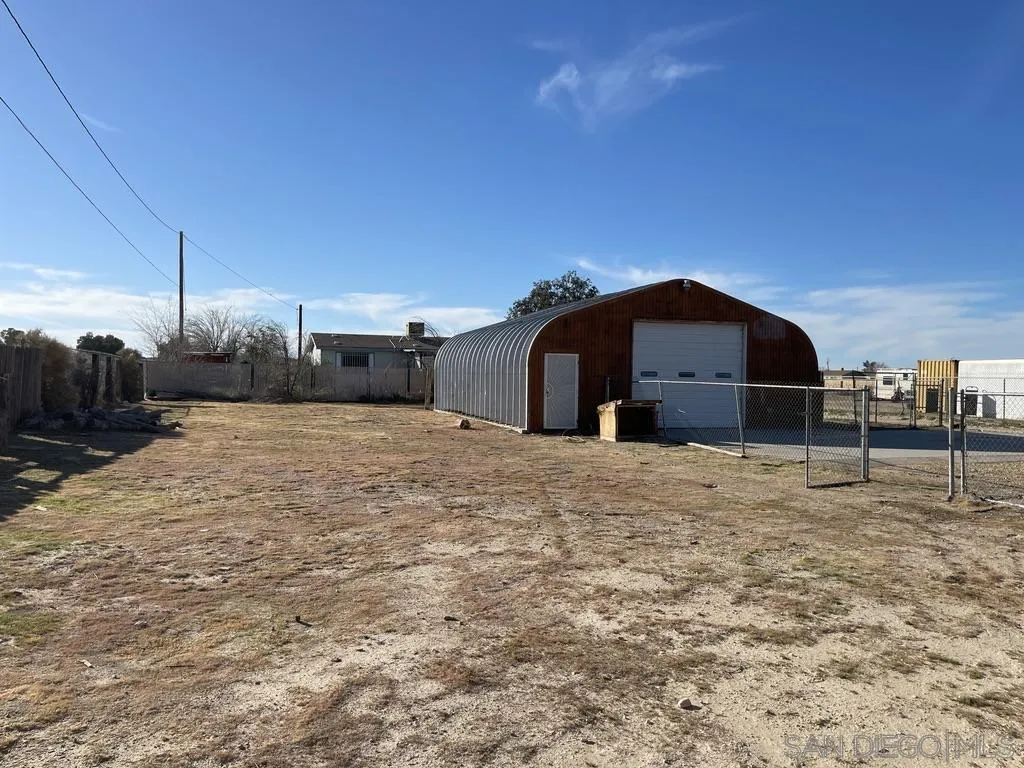 34792 Cedar Road Barstow, CA 92311 - Photo 3 of 26 a view of a house with a backyard
