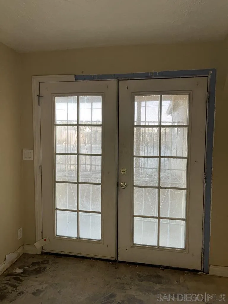 34792 Cedar Road Barstow, CA 92311 - Photo 8 of 26 an empty room with wooden floor and windows