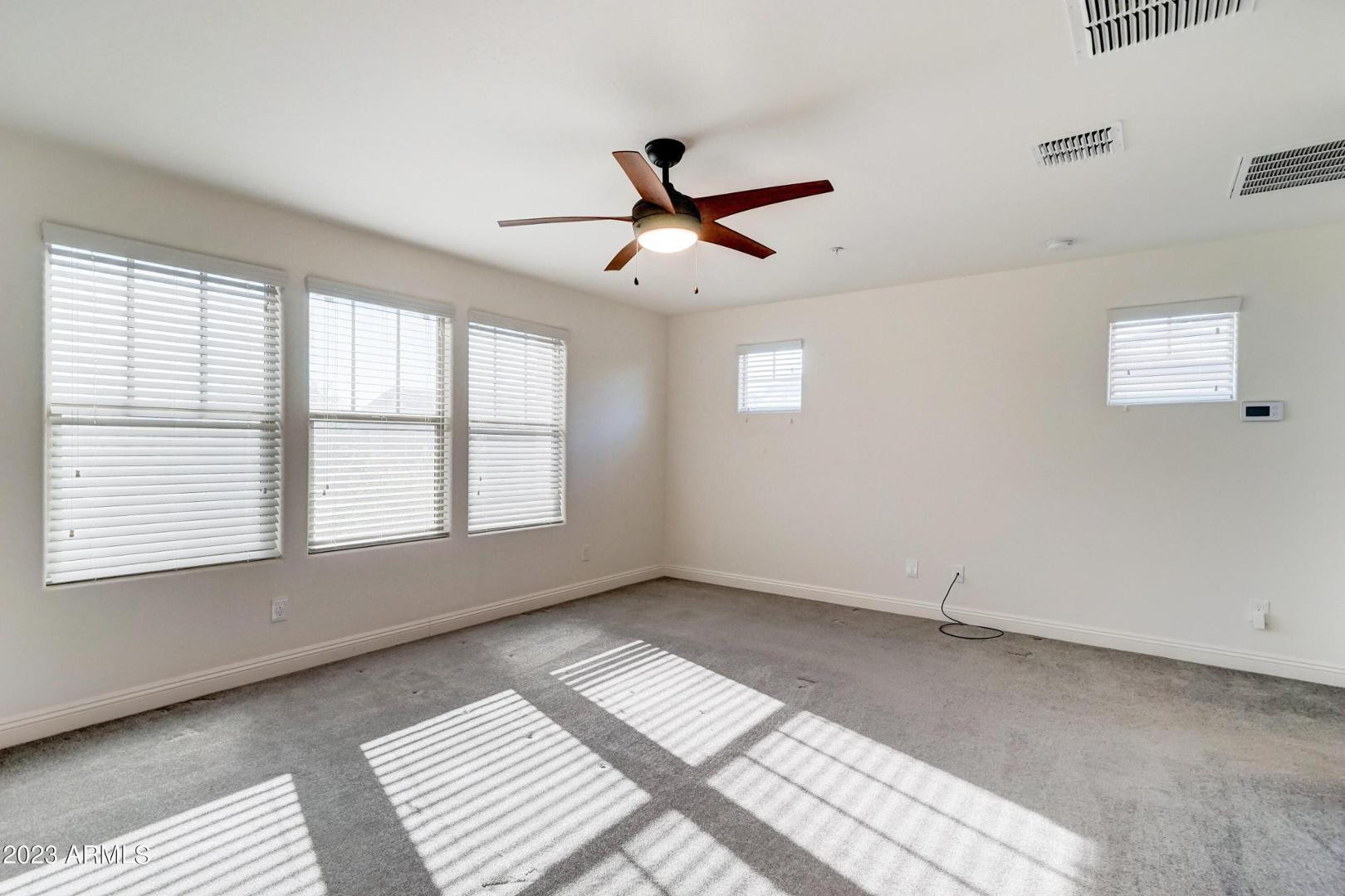 2297 North Alsap Road Buckeye, AZ 85396 - Photo 14 of 36 a view of an empty room with a window
