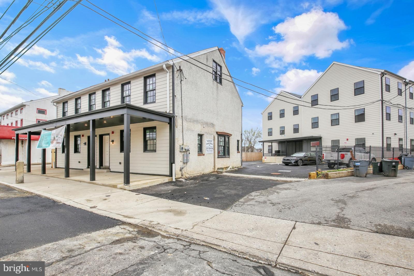 7037 Ridge Avenue, Unit 303 Philadelphia, PA 19128 - Photo 20 of 20 a view of a street that has couple of cars parked on the road