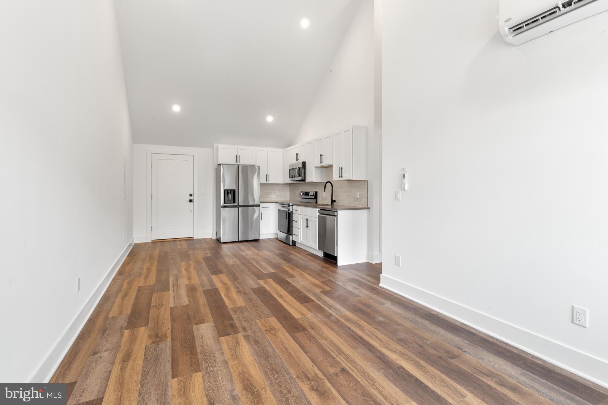 7037 Ridge Avenue, Unit 303 Philadelphia, PA 19128 - Photo 10 of 20 a view of kitchen with wooden floor