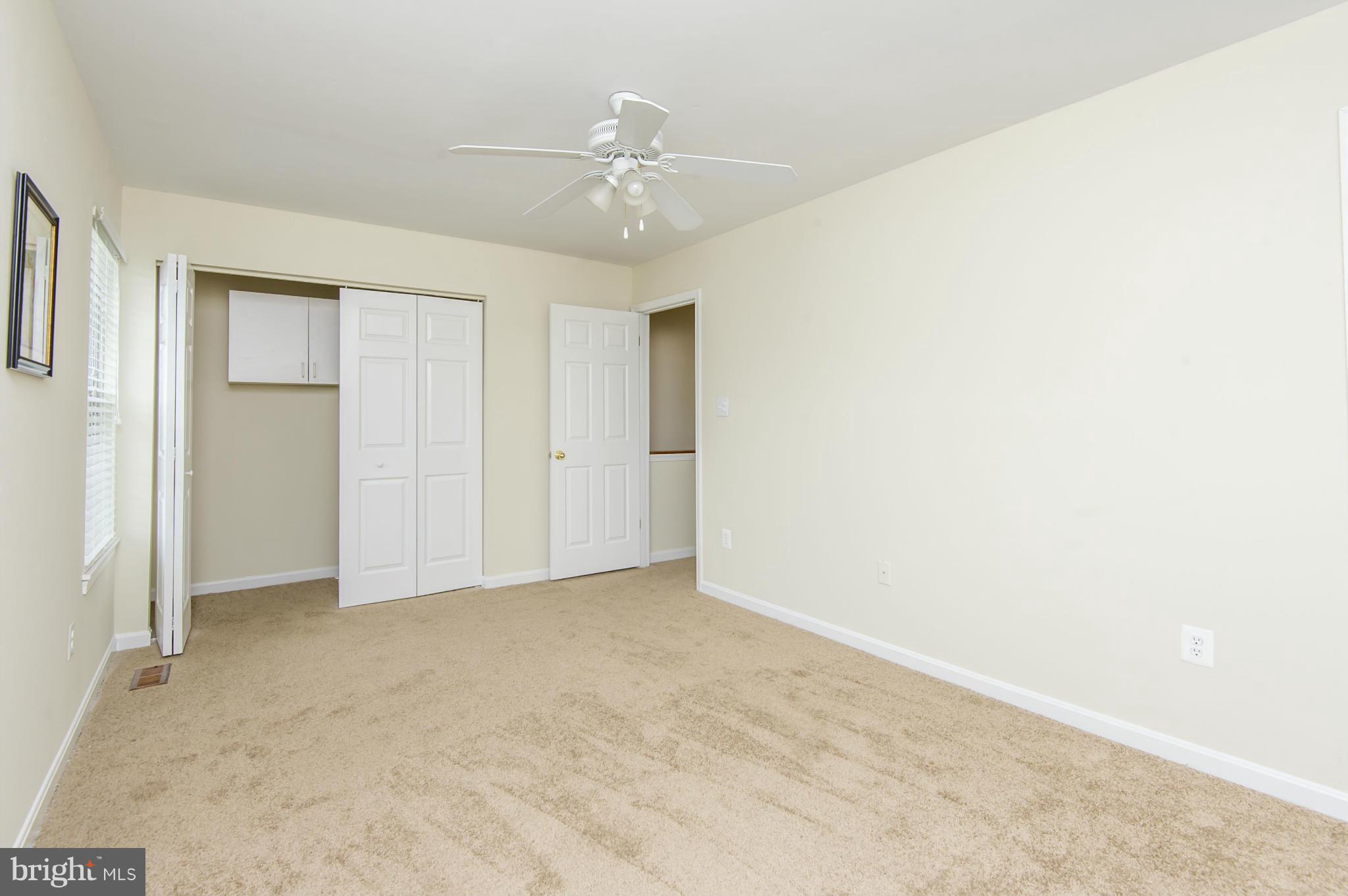 27 Offspring Court Perry Hall, MD 21128 - Photo 14 of 30 an empty room with fan and entryway