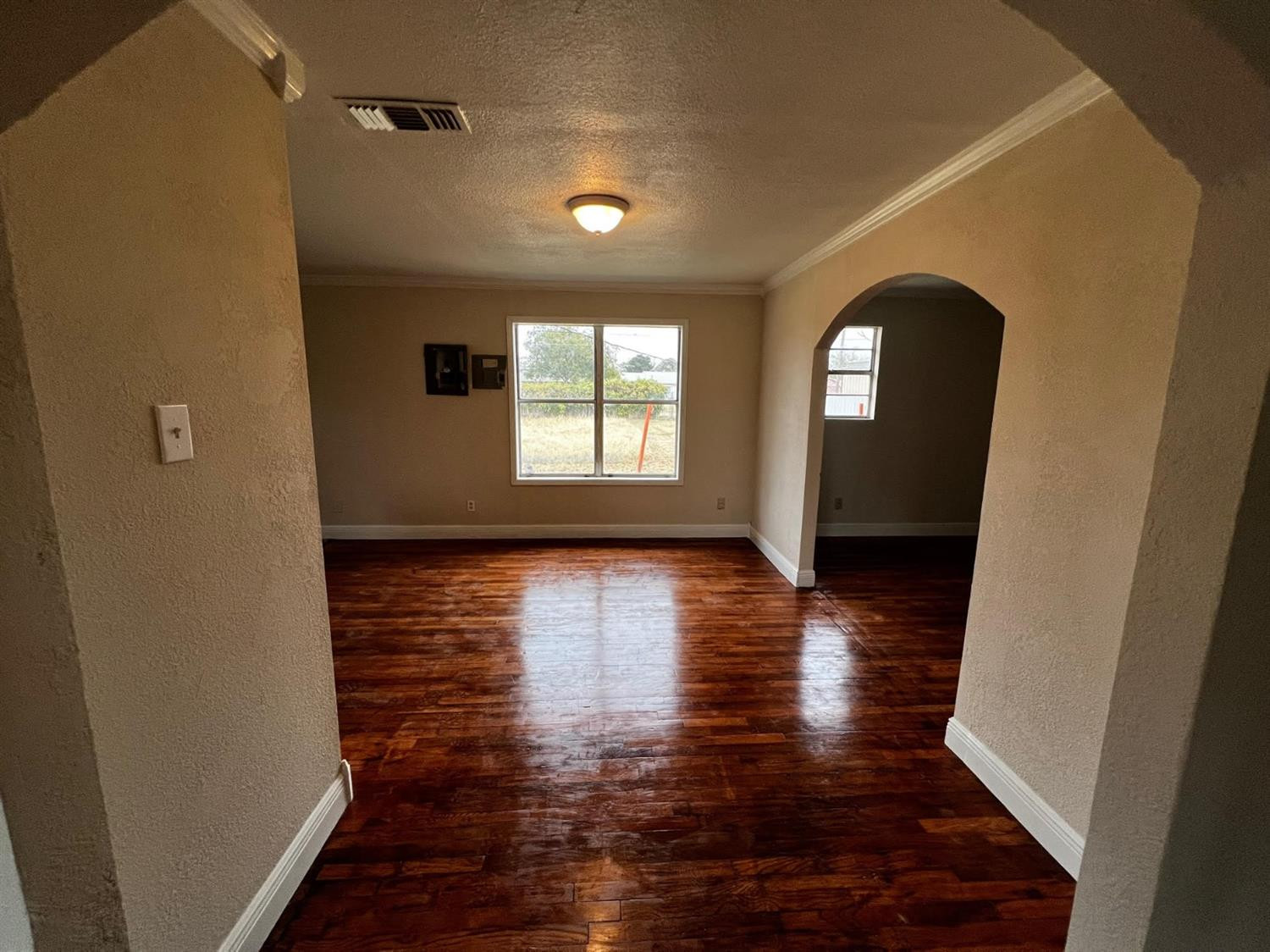 6503 Avenue T Lubbock, TX 79412 - Photo 5 of 15 a view of empty room with wooden floor and fan