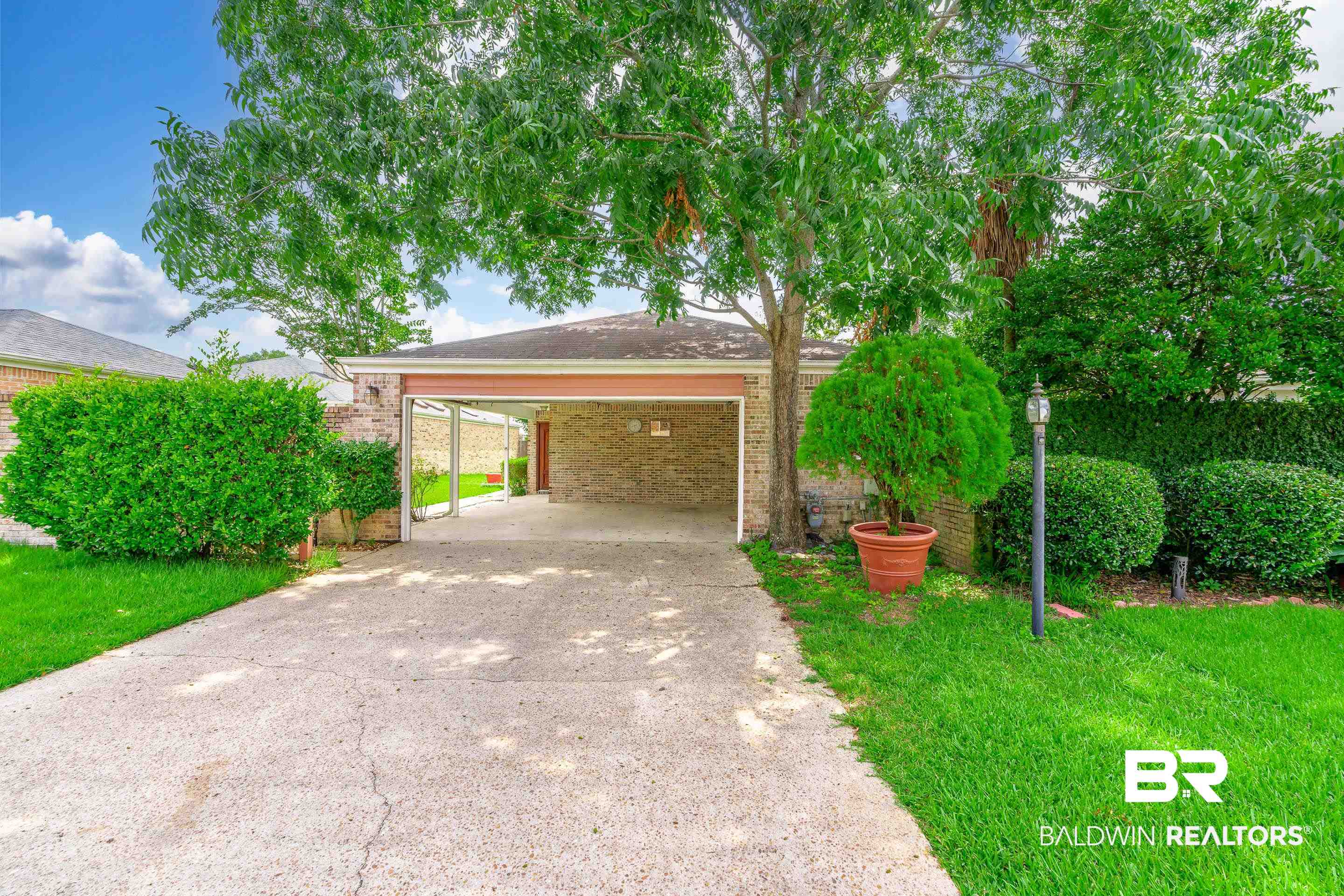 23 Old Mill Court Mobile, AL 36608 - Photo 1 of 37 Obstructed view of property with a carport and a front lawn