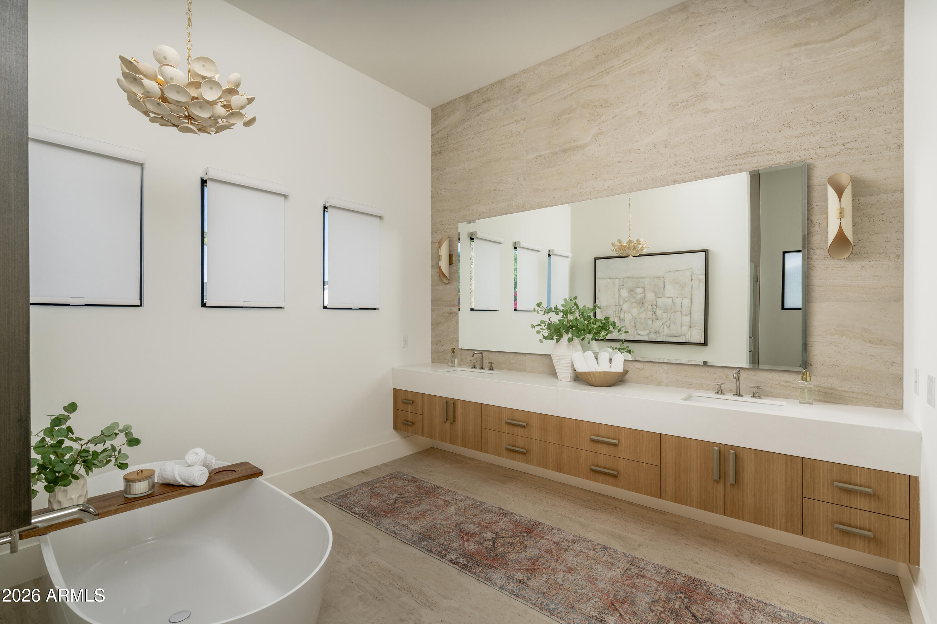 3923 East Heatherbrae Drive Phoenix, AZ 85018 - Photo 23 of 58 a bathroom with a double vanity sink and a mirror