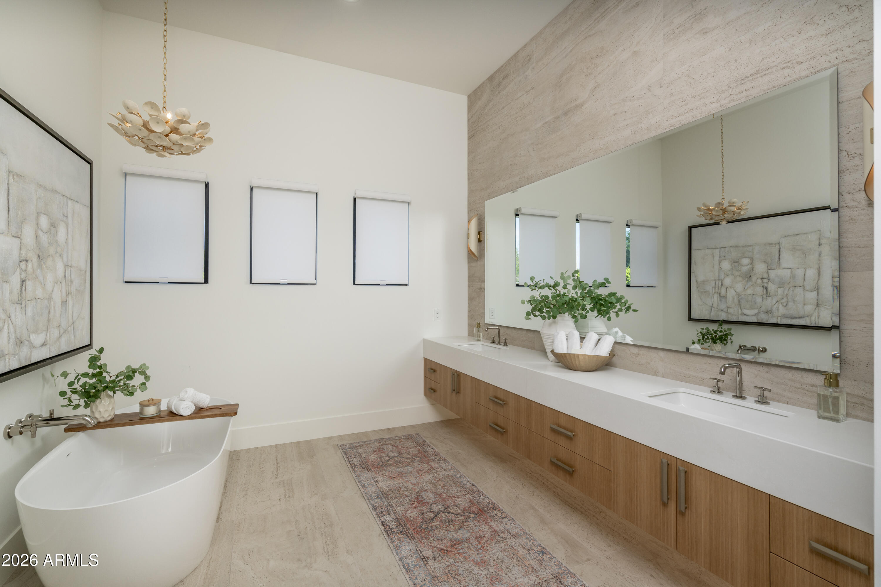 3923 East Heatherbrae Drive Phoenix, AZ 85018 - Photo 25 of 58 a spacious bathroom with a double vanity sink and a bathtub