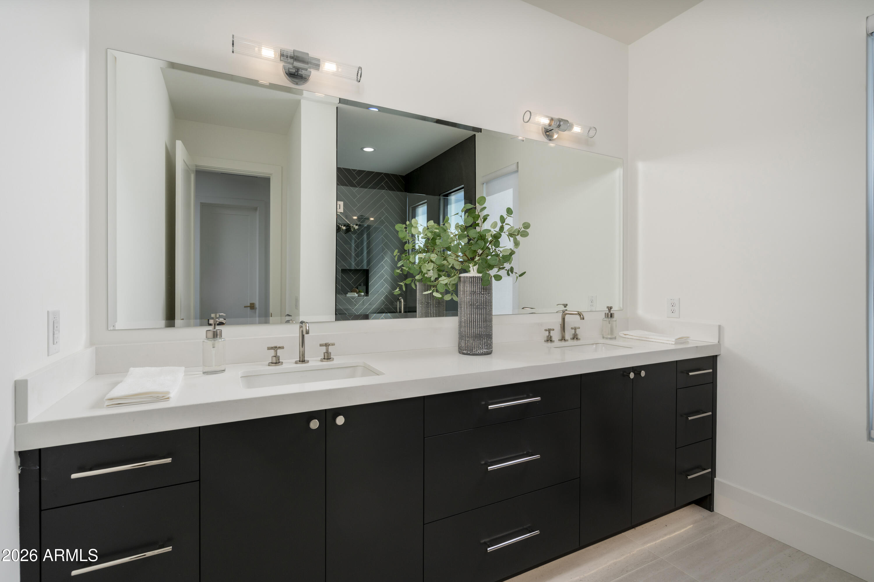 3923 East Heatherbrae Drive Phoenix, AZ 85018 - Photo 36 of 58 a bathroom with a double vanity sink and mirror