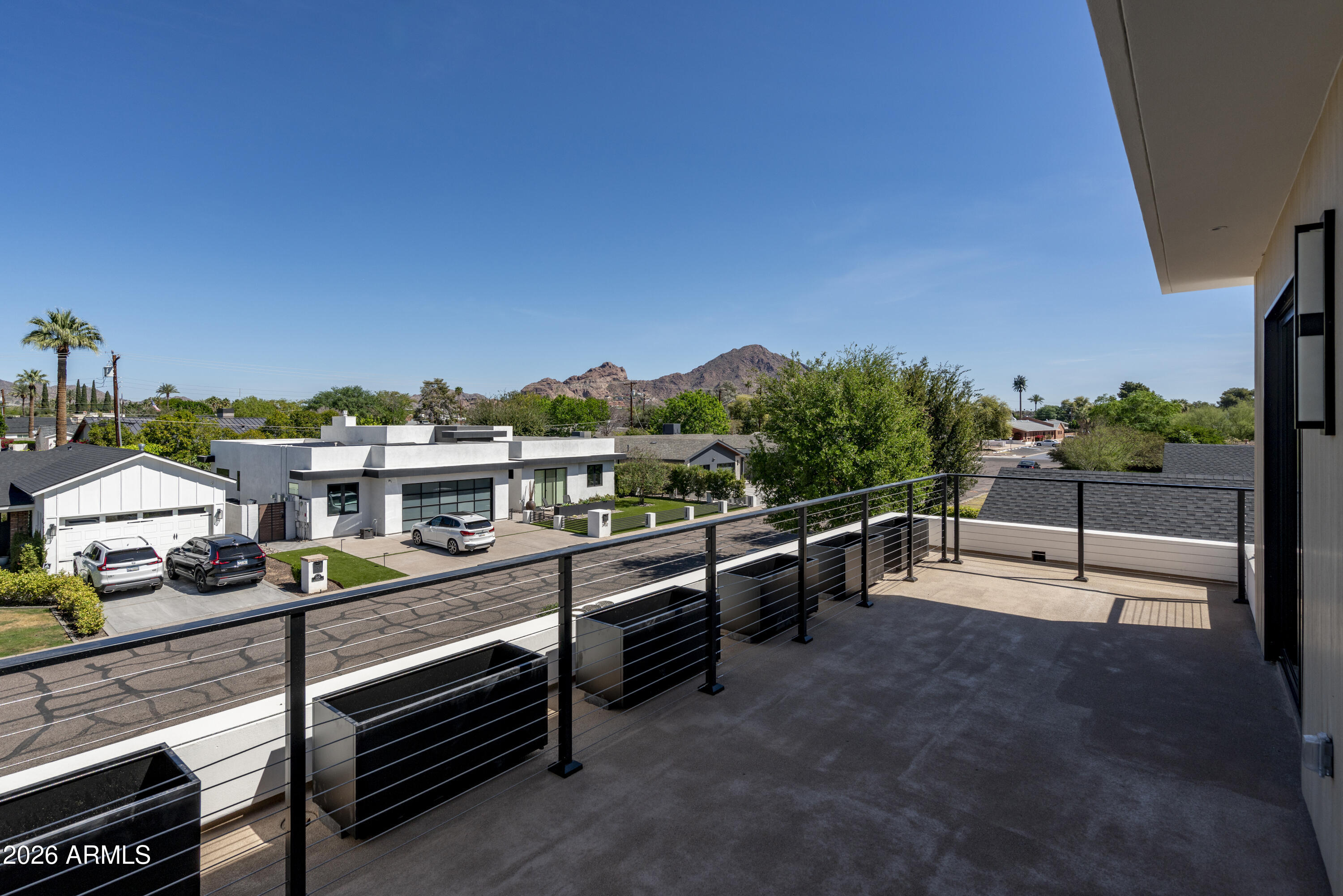 3923 East Heatherbrae Drive Phoenix, AZ 85018 - Photo 42 of 58 a view of a terrace with lawn chairs