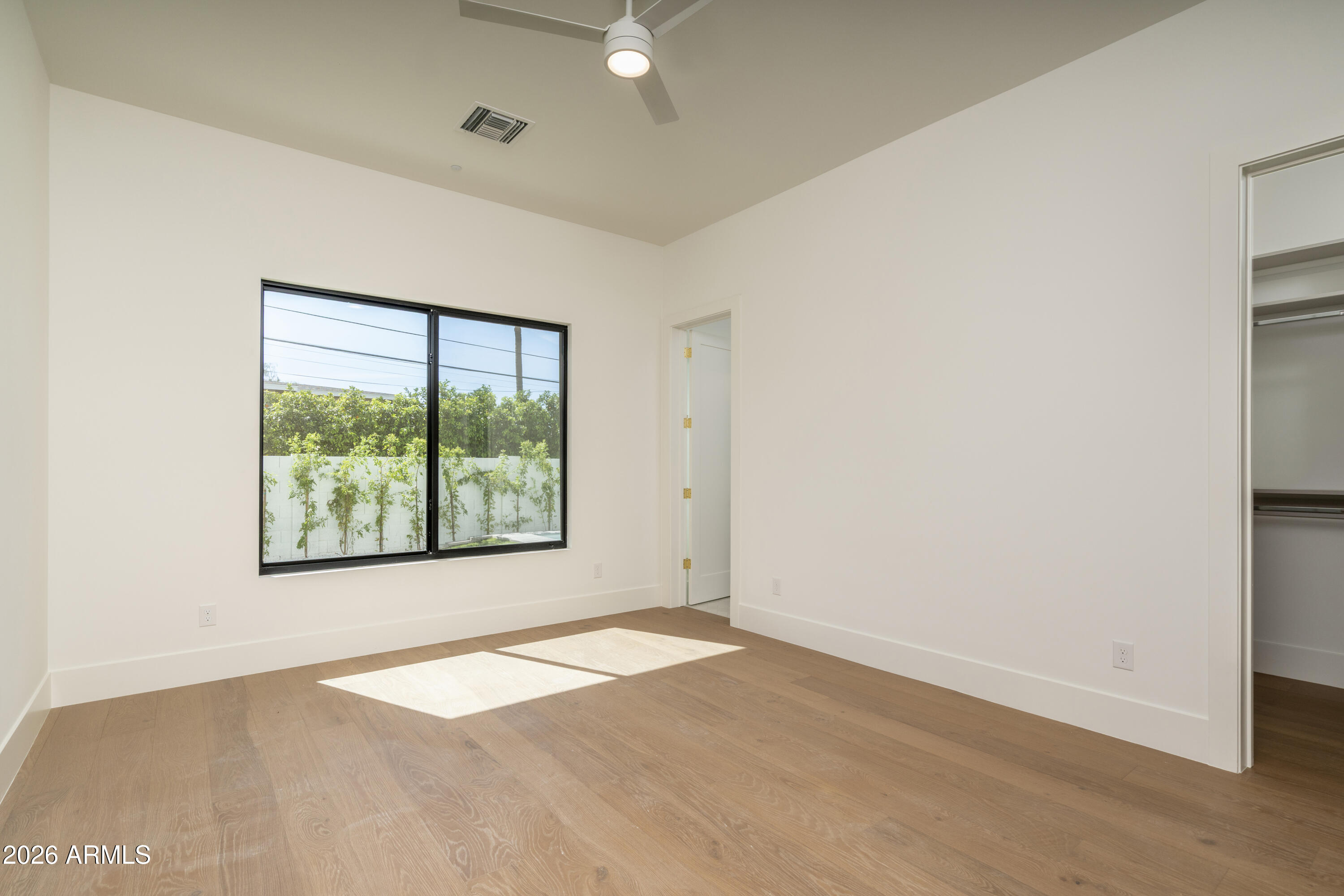 3923 East Heatherbrae Drive Phoenix, AZ 85018 - Photo 43 of 58 an empty room with a window