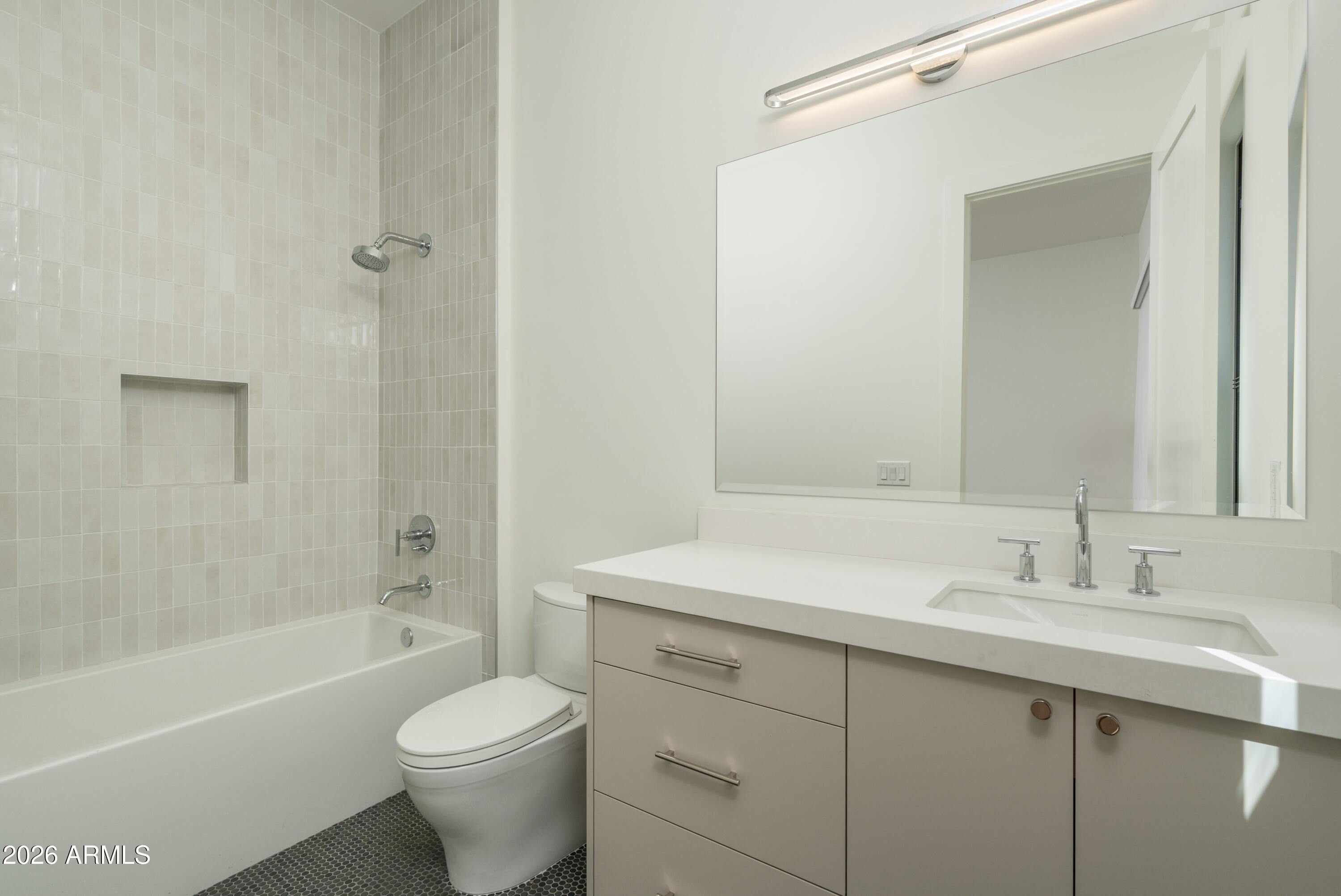 3923 East Heatherbrae Drive Phoenix, AZ 85018 - Photo 48 of 58 a bathroom with a sink toilet and shower