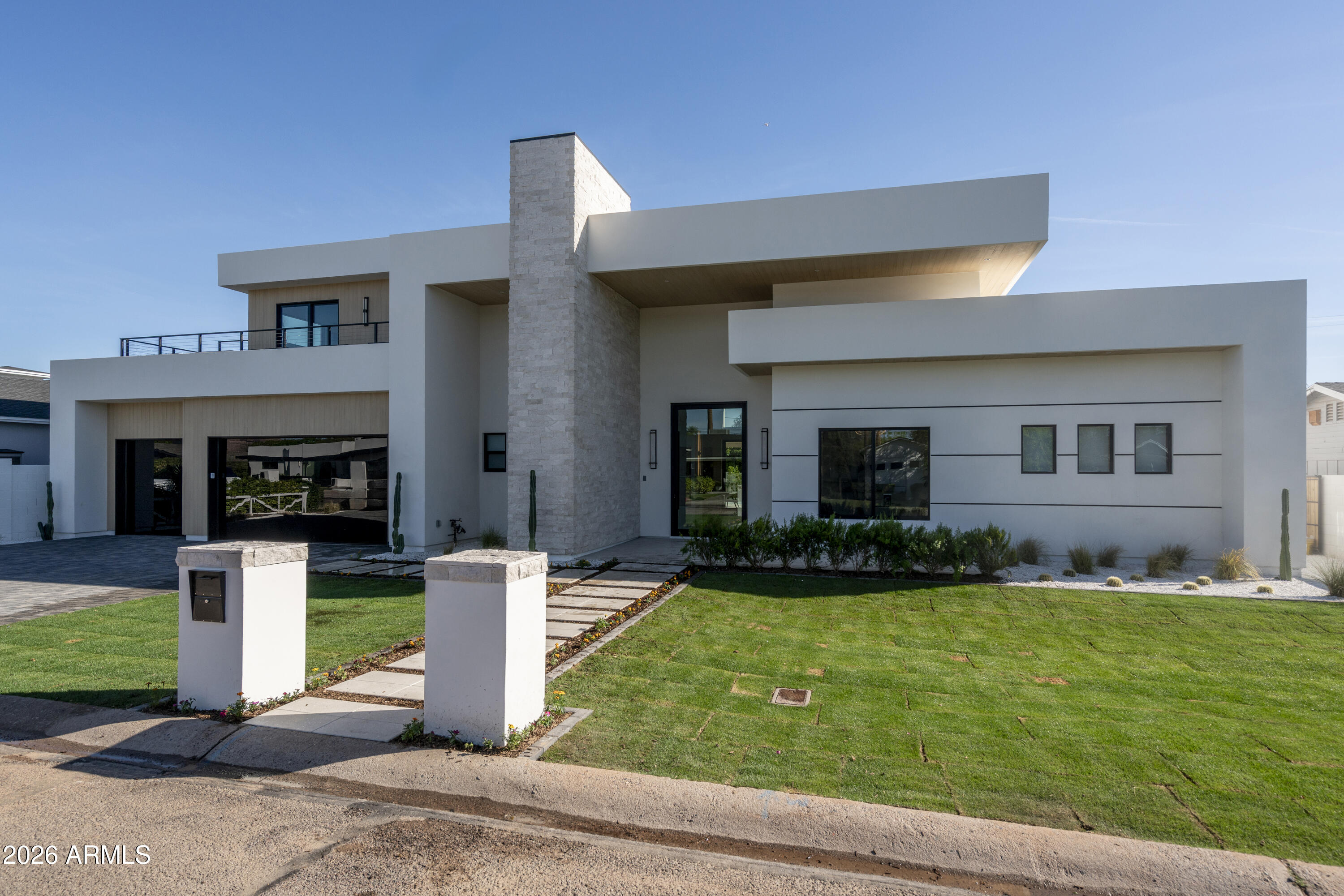 3923 East Heatherbrae Drive Phoenix, AZ 85018 - Photo 51 of 58 a front view of a house with a yard and garage
