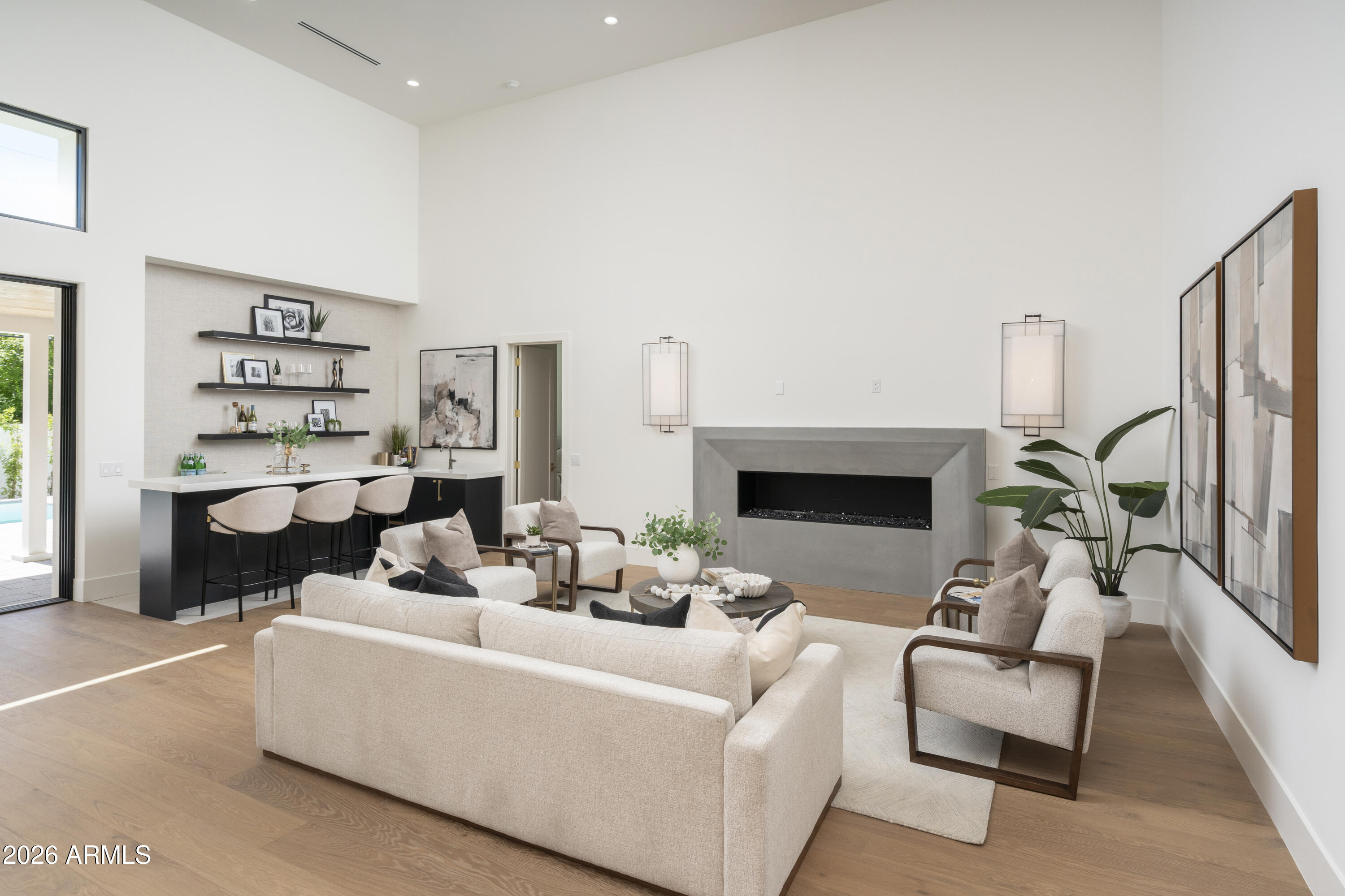 3923 East Heatherbrae Drive Phoenix, AZ 85018 - Photo 6 of 58 a living room with furniture and a fireplace