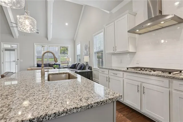 a kitchen with sink cabinets and window