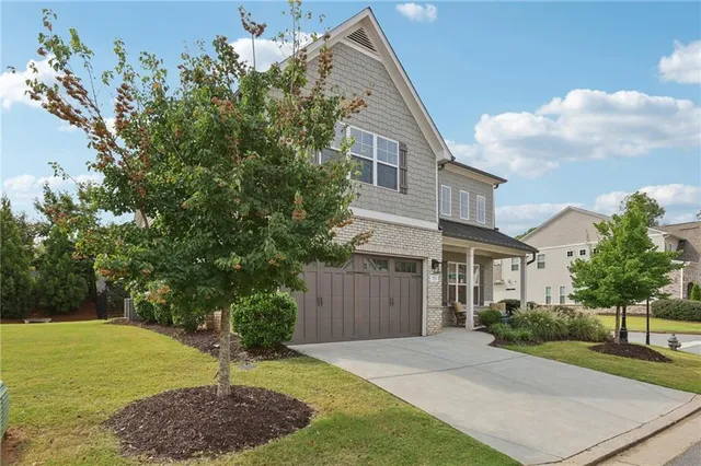 a front view of a house with a yard
