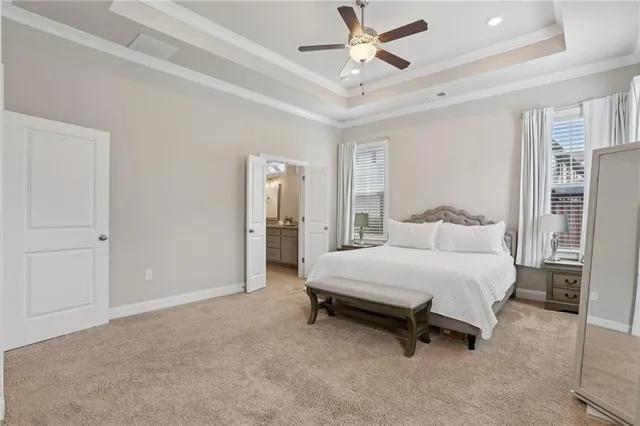 a bathroom with a granite countertop double vanity sink and a mirror