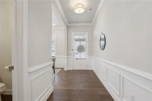 a view of a kitchen with a refrigerator and a stove top oven