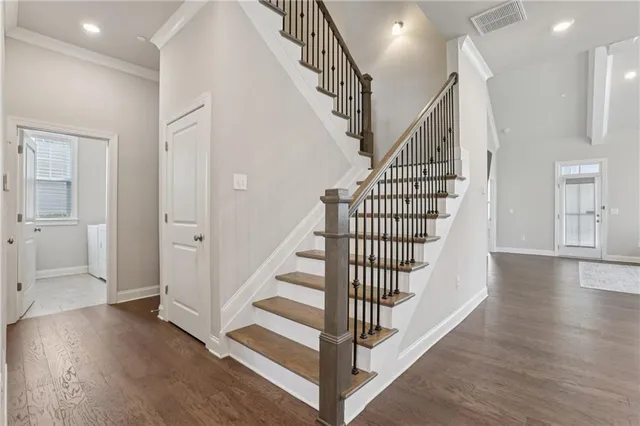 a view of a hallway with closet and utility room