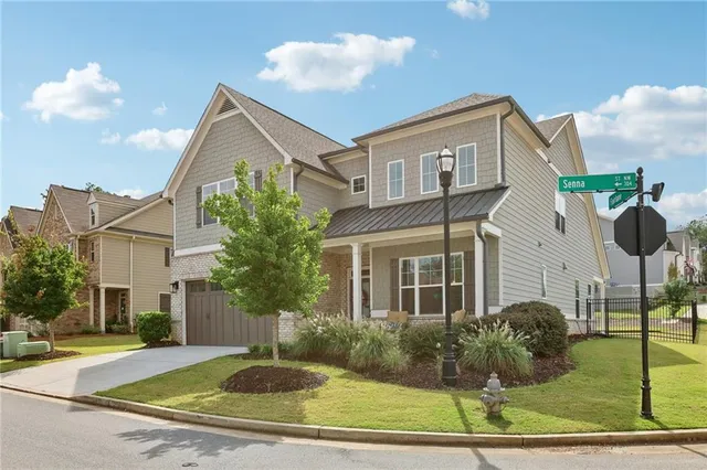 a front view of a house with garden