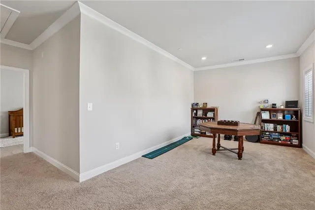 a spacious bedroom with a bed and a window