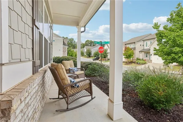 a large kitchen with stainless steel appliances kitchen island granite countertop a large island in the center