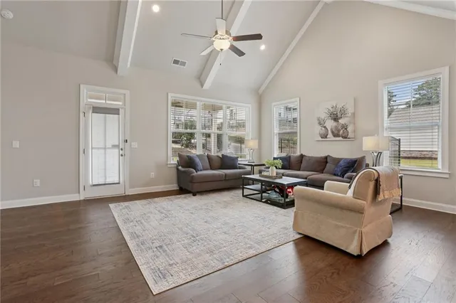 a kitchen with stainless steel appliances kitchen island a refrigerator and a stove top oven