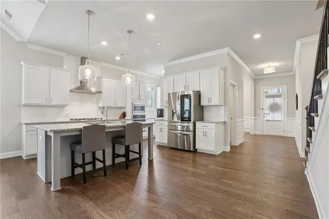 a spacious bedroom with a bed and window