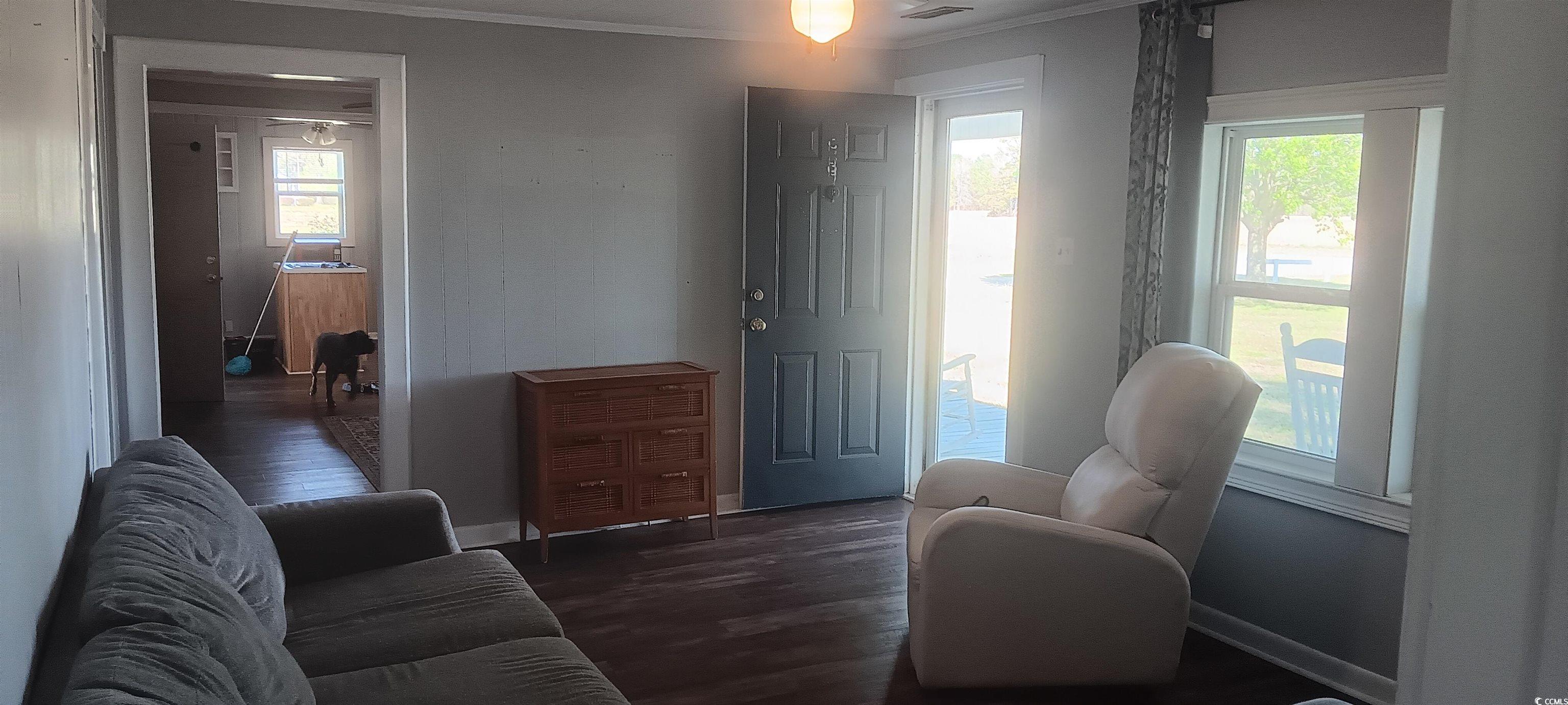 360 Green Sea Road South Loris, SC 29569 - Photo 11 of 27 Living area with a wealth of natural light, basebo