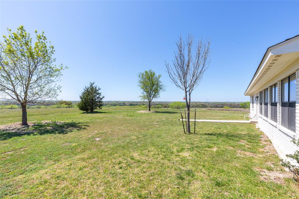 642 Fm 3200 Comanche, TX 76442 - Photo 29 of 37 a view of yard with swimming pool and green space