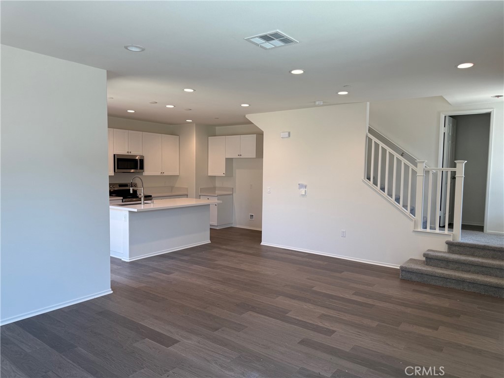 2246 Springmeadow Court Highland, CA 92346 - Photo 2 of 6 a view of kitchen with granite countertop stainless steel appliances refrigerator and microwave