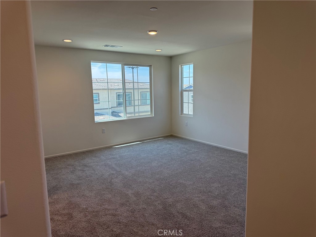2246 Springmeadow Court Highland, CA 92346 - Photo 6 of 6 a view of an empty room with a window