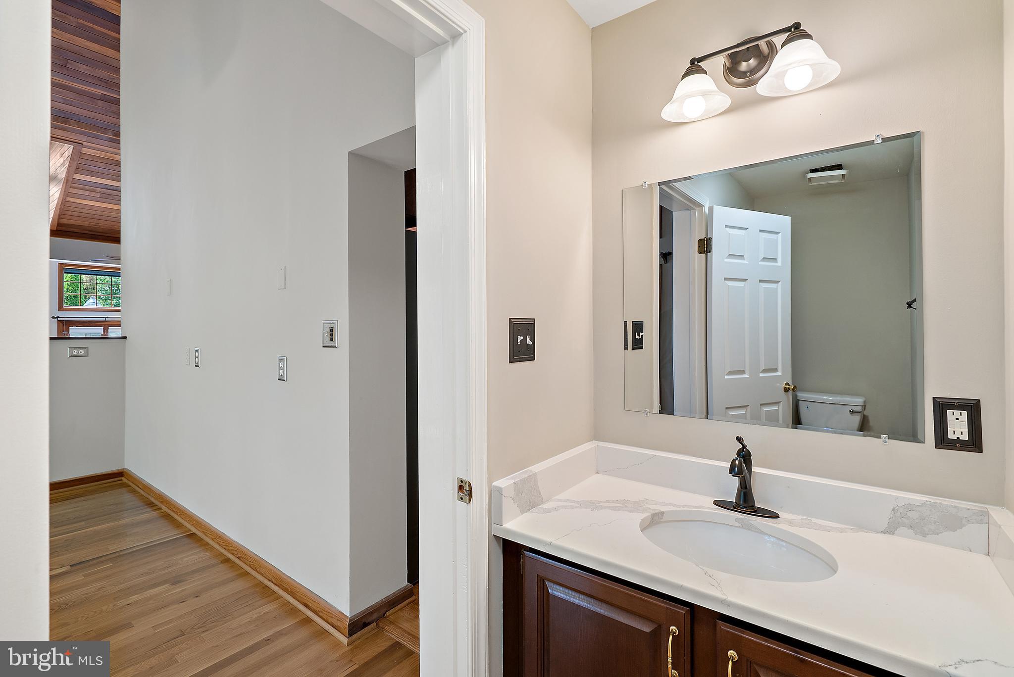 638 Seneca Road Great Falls, VA 22066 - Photo 27 of 83 Half bath on the main level