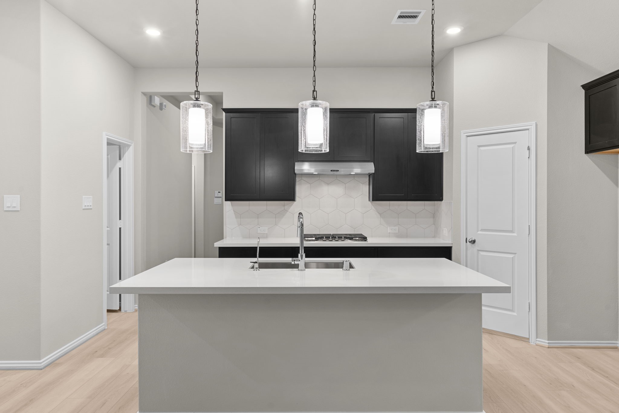 9628 Mount Brewer Lane Porter, TX 77365 - Photo 3 of 36 a kitchen with kitchen island stainless steel appliances a sink and a refrigerator