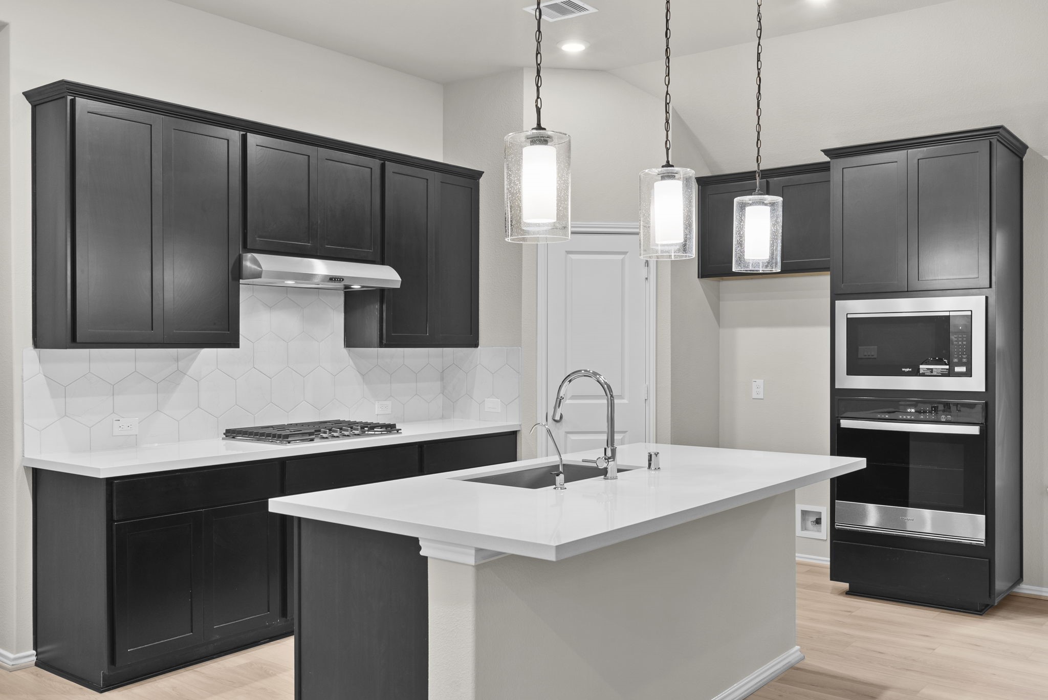 9628 Mount Brewer Lane Porter, TX 77365 - Photo 4 of 36 a kitchen with a sink and stainless steel appliances