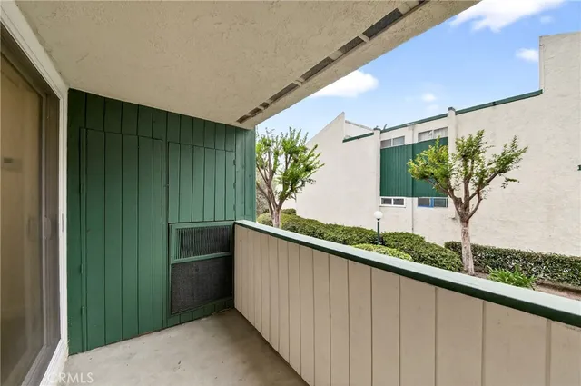 a view of a balcony and plant