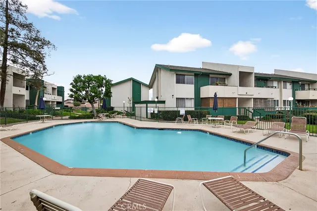 a view of a swimming pool with a lounge chairs