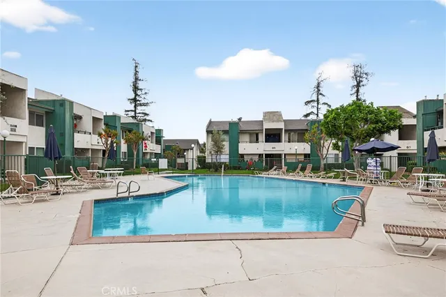 a view of a swimming pool with a patio