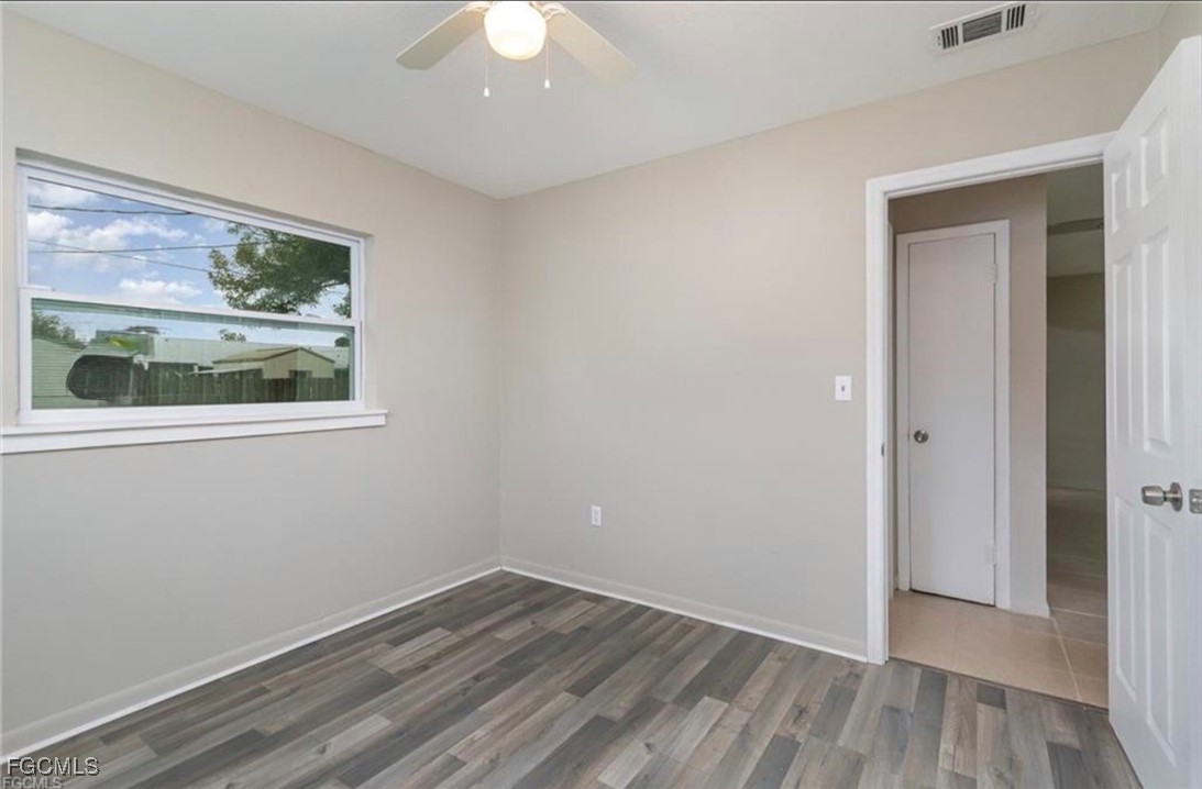 12937 Fourth Street Fort Myers, FL 33905 - Photo 16 of 26 a view of an empty room with wooden floor and a window