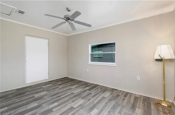 a view of an empty room with a window