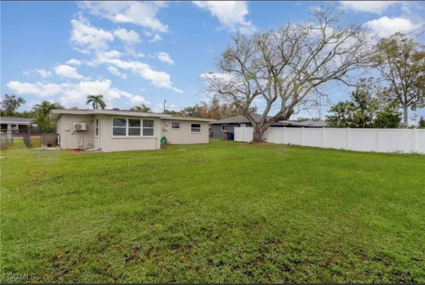 a view of a house with a yard