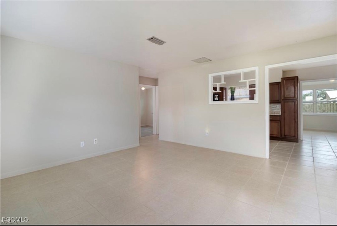 12937 Fourth Street Fort Myers, FL 33905 - Photo 4 of 26 a view of a big room with wooden floor and windows