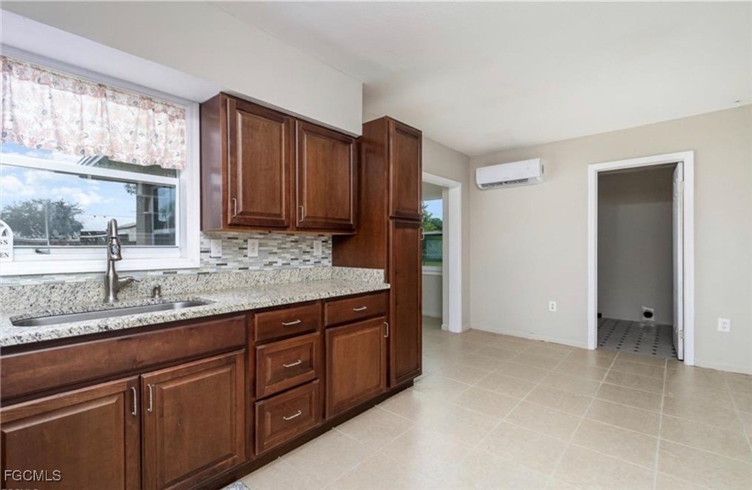 12937 Fourth Street Fort Myers, FL 33905 - Photo 7 of 26 a bathroom with a granite countertop sink and a mirror