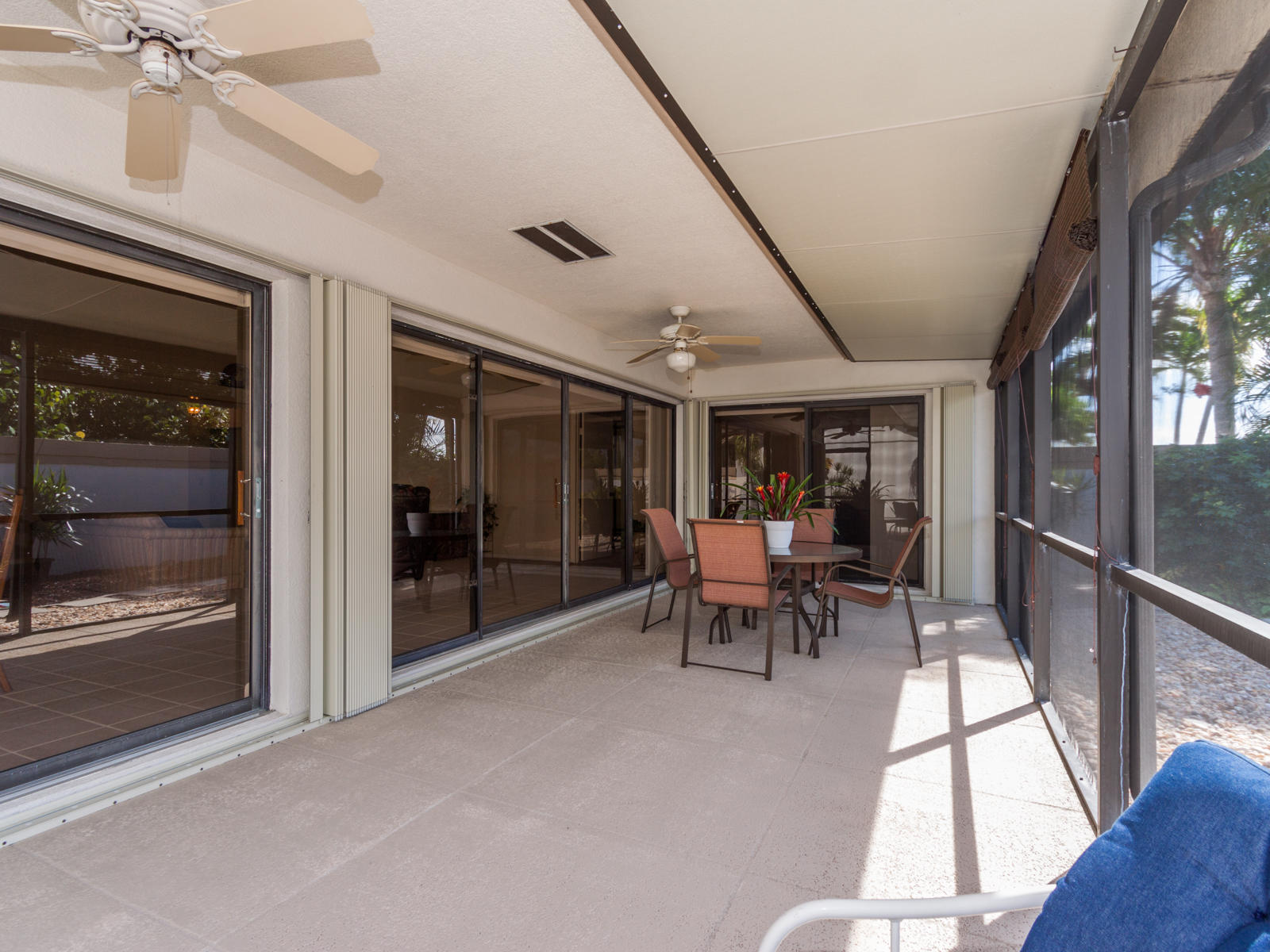 186 Ridge Road Jupiter, FL 33477 - Photo 35 of 44 a dining room with furniture and a floor to ceiling window