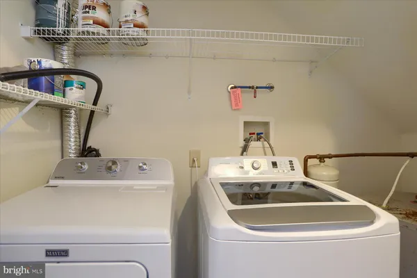 a bathroom with a sink and washing machine