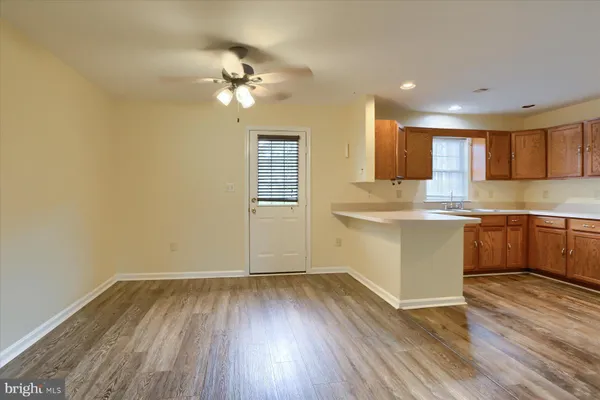 a kitchen with a cabinets and chandelier