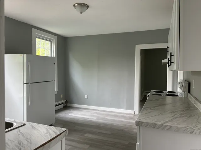 a view of a kitchen with a sink