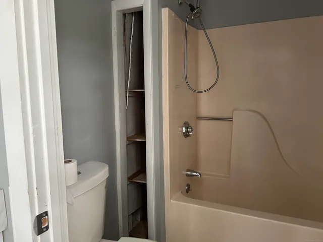 a bathroom with a glass shower door