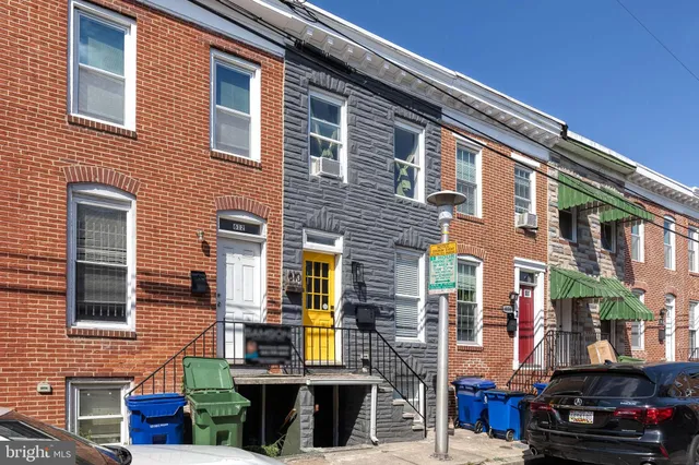 a front view of a house with parking space