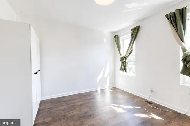 an empty room with windows and