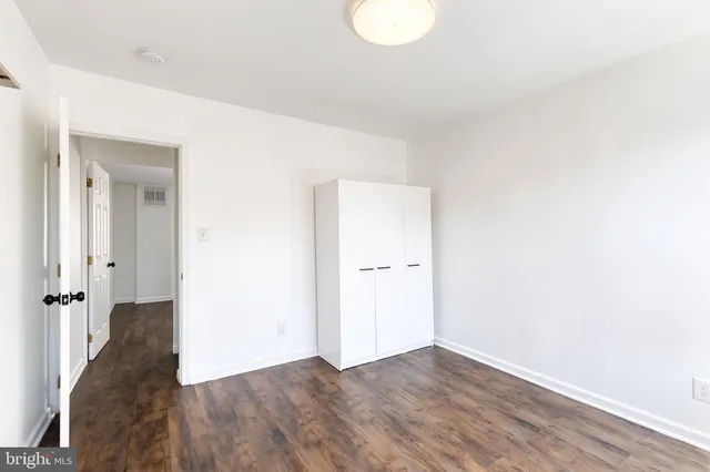 a view of a livingroom with wooden floor